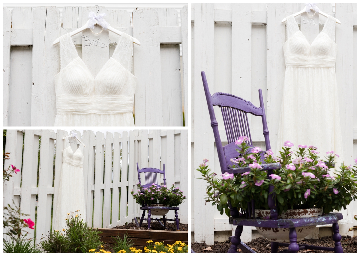 Wedding dress hanging on a fence in the garden