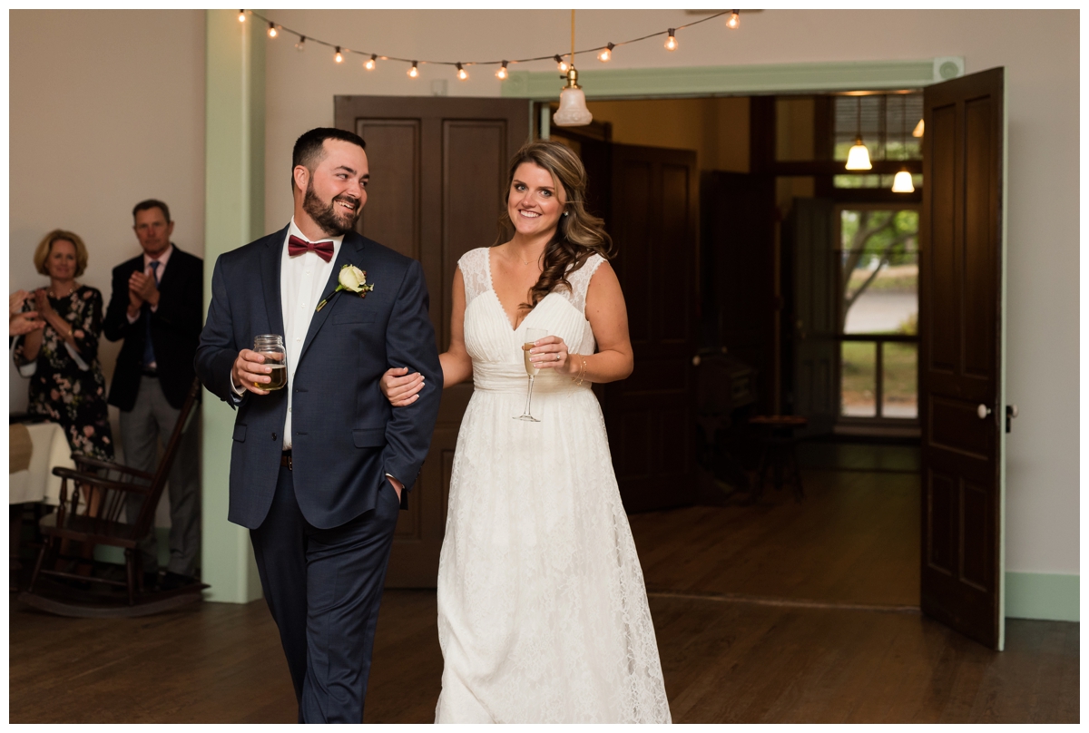 Newlyweds being announced into their wedding reception