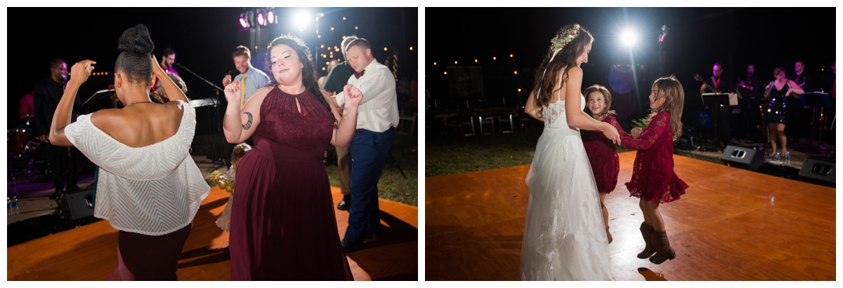 Bride dancing with guests on the dance floor at wedding outside