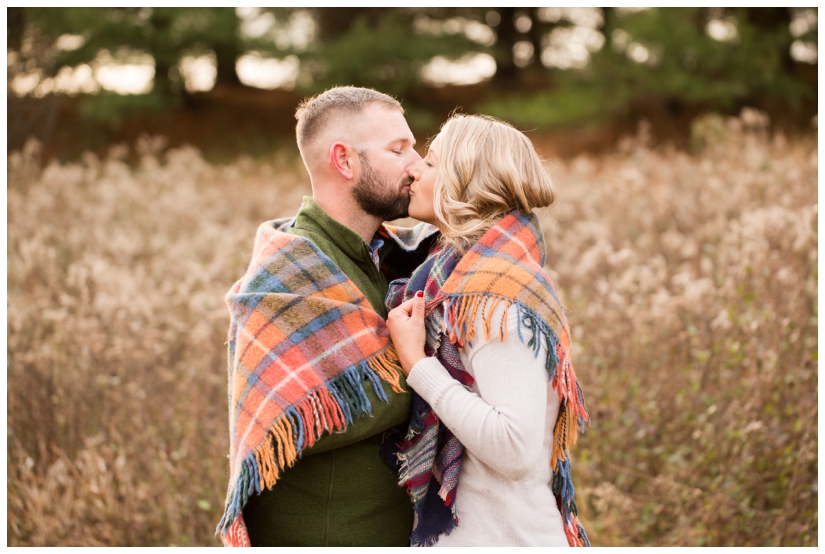 Fall Lake Hashawa engagement session. Couple wrapped in blanket