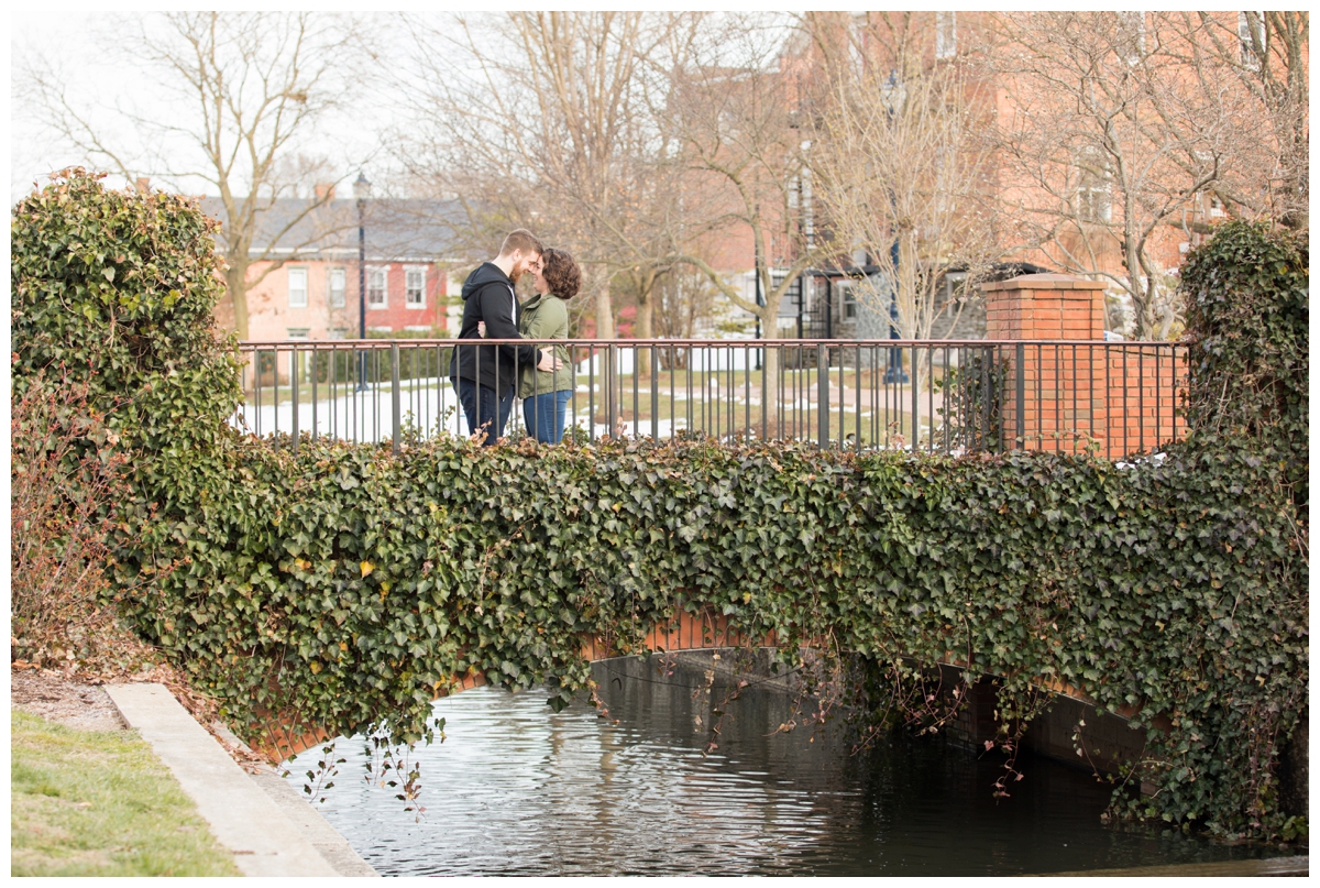 Engaged Couple with Disney Themed Frederick Maryland Engagement Photos on bridge