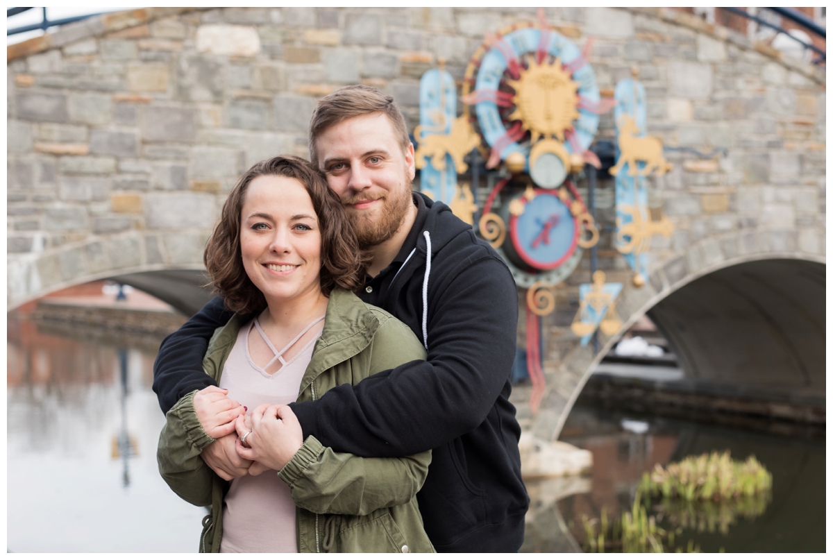 Engaged Couple with Disney Themed Frederick Maryland Engagement Photos by the bridge