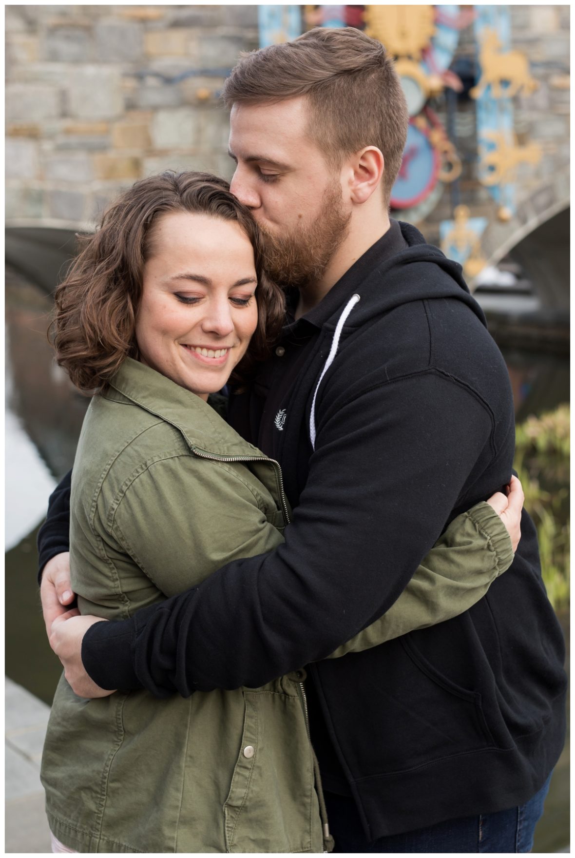 Engaged Couple with Disney Themed Frederick Maryland Engagement Photos by the bridge