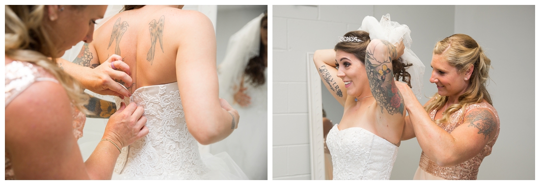 Bride getting into her wedding dress with the help of her maid of honor. Maryland wedding at Circle D Farm in Woodbine. Maryland Wedding Photographer