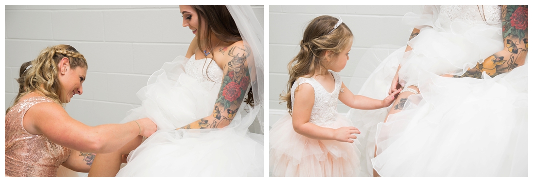 Maid of honor helping the bride put on her garter and cowgirl boots. Bride boots. Maryland wedding at Circle D Farm in Woodbine. Maryland Wedding Photographer