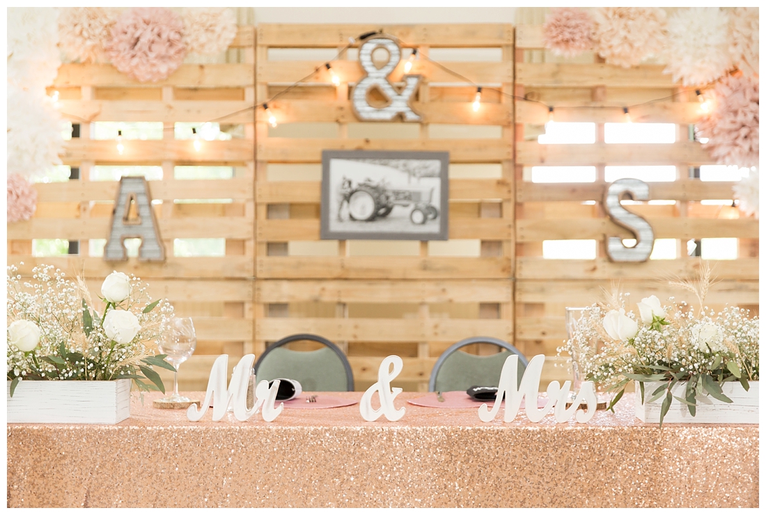 Reception details and decor. Rustic wedding decor. Rose gold wedding decor. Sweetheart table. Wedding Pallet Wall. Maryland wedding at Circle D Farm in Woodbine. Maryland Wedding Photographer.