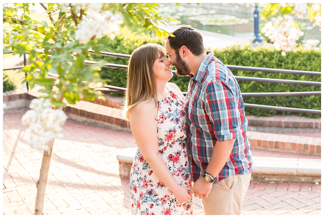 Engaged Couple. Downtown frederick engagement photos. Floral engagement session. Carroll Creek engagement photos. Engagement by the water. Bridge engagement photos. Engagement photo ideas.