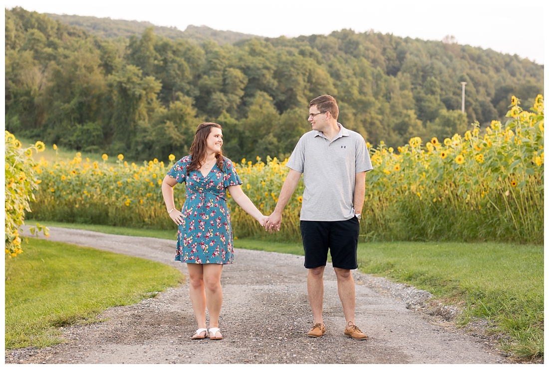 Maryland Wedding Photography Sunflower engagement photos. Maryland engagement. Bride and groom to be in flower fields. Flower fields maryland farm engagement photos.