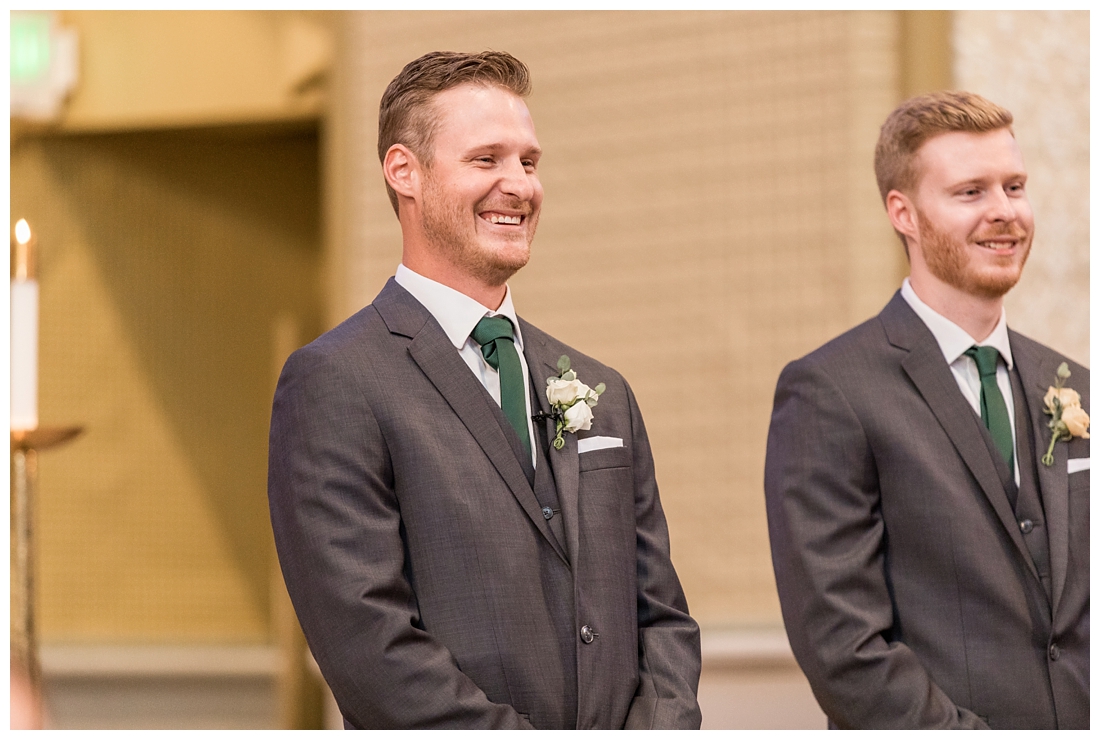 Towson Maryland Catholic Church Ceremony. Joppa Maryland Mountain Branch Golf Club Wedding. The Belvedere bridal wedding preparation.  Groom cries and smiles as the bride walks down the aisle