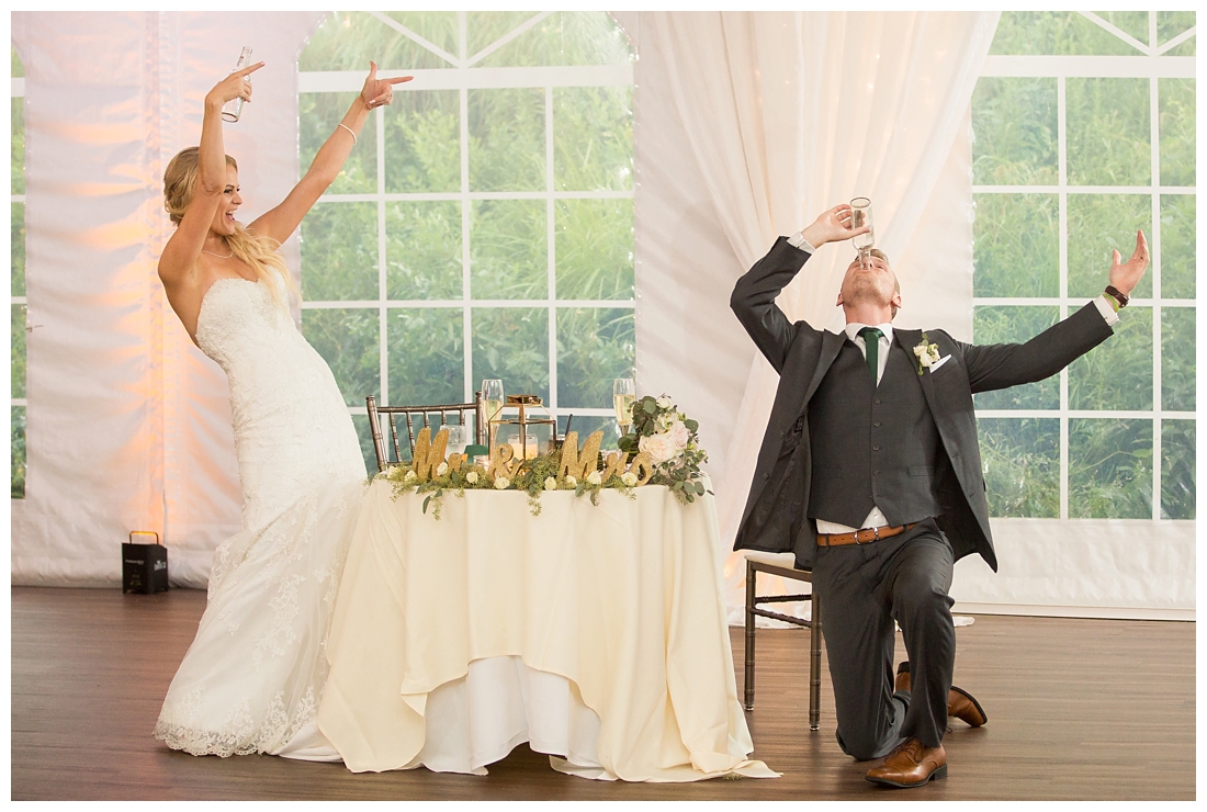 Towson Maryland Catholic Church Ceremony. Joppa Maryland Mountain Branch Golf Club Wedding. The Belvedere bridal wedding preparation.  Bride beats groom in Smirnoff Ice Chug