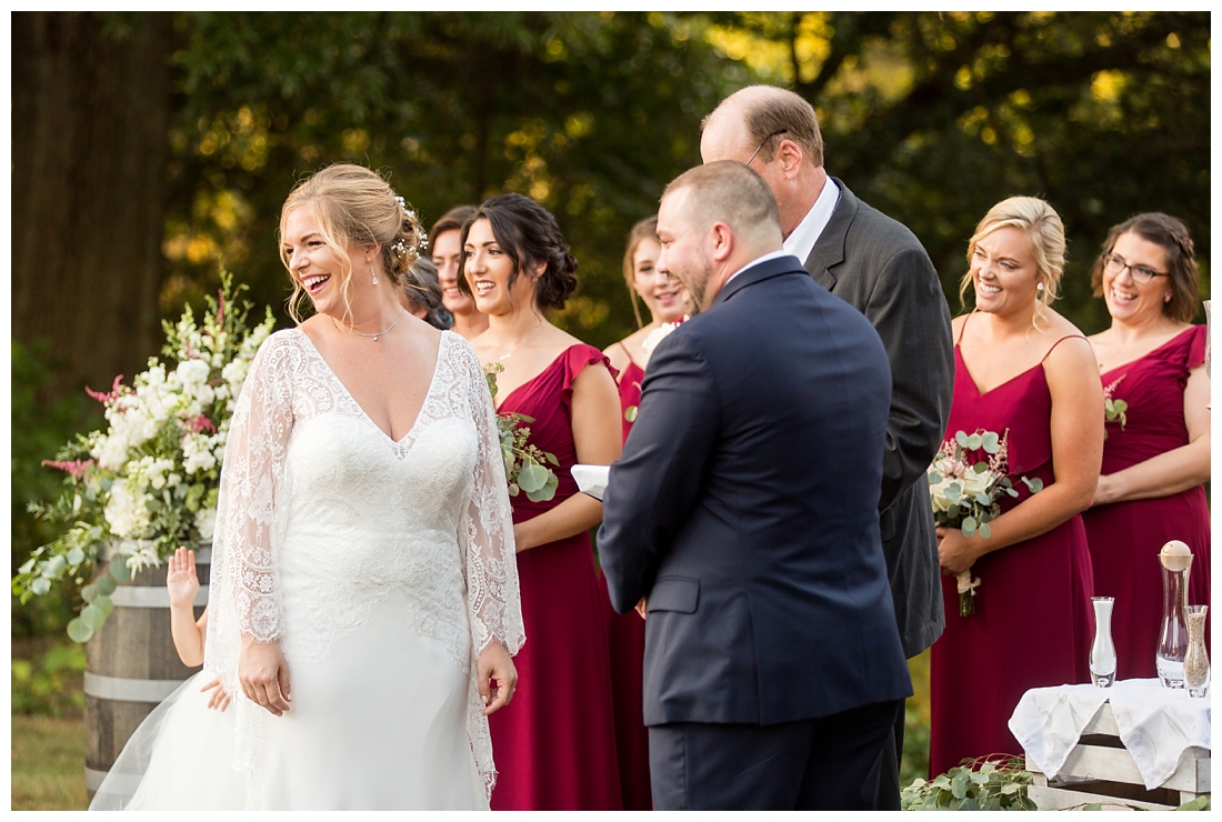 Eastern Shore Wedding. Water Front Wedding. Maryland Wedding. Queenstown Maryland. Fall October Wedding. Burgundy and Navy wedding colors. Maryland Wedding Photographer, Annapolis Wedding Photographer. Wedding at private residence, wedding at our home, tent wedding. waterfront ceremony bride smiling