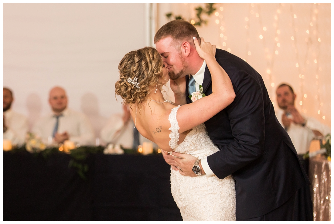 Fall wedding at The Royer House in Westminster Maryland. Cool fall day with dusty blue theme. Carroll County wedding. Cold Wedding day. Windy Wedding. Farm Wedding. bride and groom first dance. Dip and kiss during first dance. 