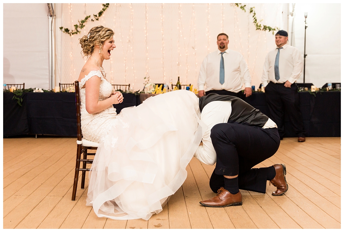 Fall wedding at The Royer House in Westminster Maryland. Cool fall day with dusty blue theme. Carroll County wedding. Cold Wedding day. Windy Wedding. Farm Wedding. Garter romoval, groom takes off garter with his mouth.