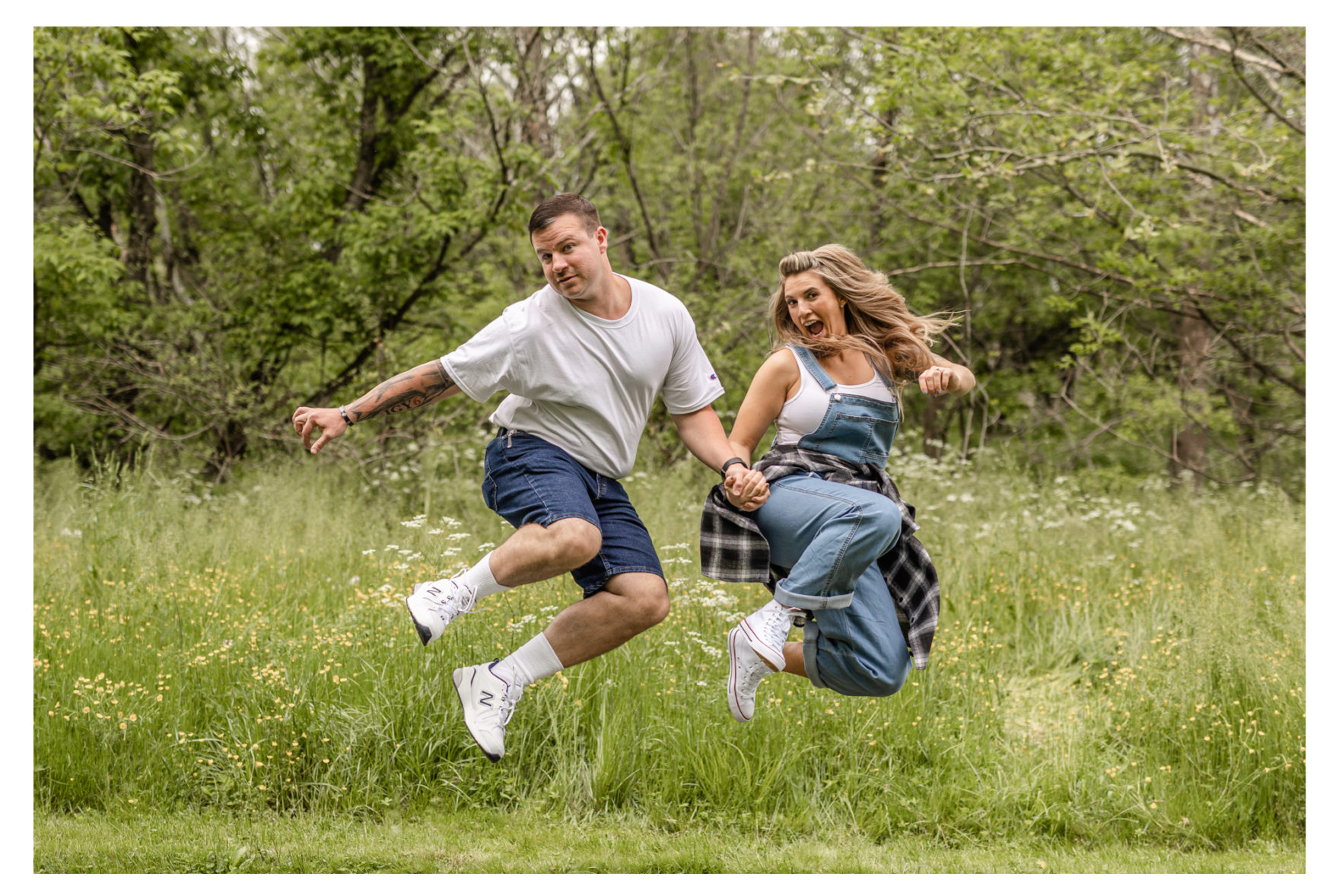 90's theme. 90's photo session. 90's awkward photos. 90's couple photos. 90's couple portraits. 90's couple glamour shots. 90's pregnancy announcement. new pair of genes. Jean overalls. Jorts. Dad Jeans. Mom Jeans. New balances. Awkward Couple Poses. Awkward portrait session.